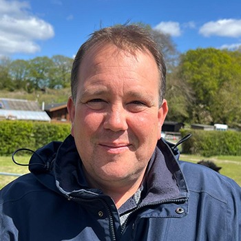 Smiling man outdoors in jacket